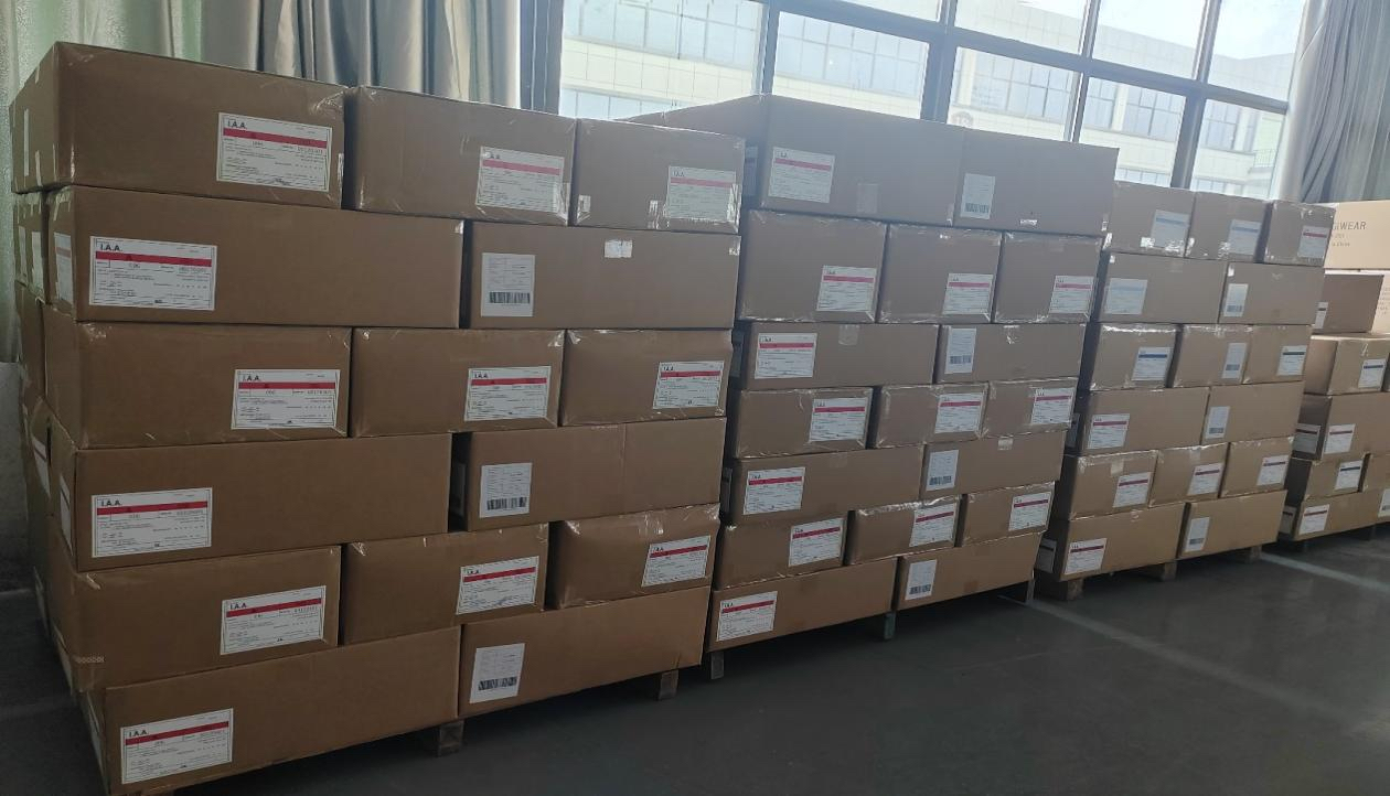 Finished apparel cartons packed and labeled before loading